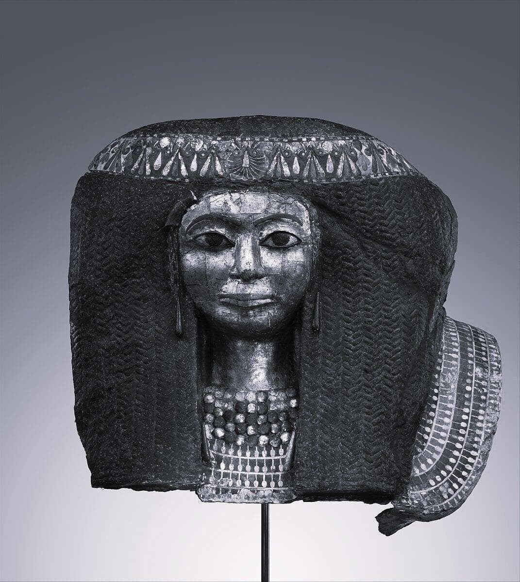Egyptian mask of woman with wig and makeup